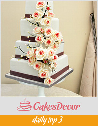 Roses and blossom branches wedding cake