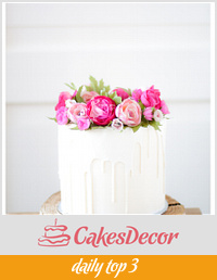 White chocolate dripping cake with handmade flowers