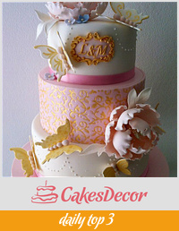 Wedding anniversary cake in pink and gold