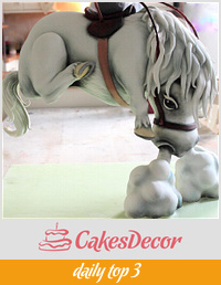 Naughty pony sculpted suspended cake