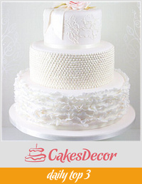 Blush pink ruffles, lace and rose wedding cake
