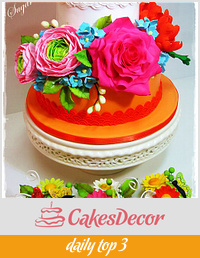 Cake with flowers and cupcakes