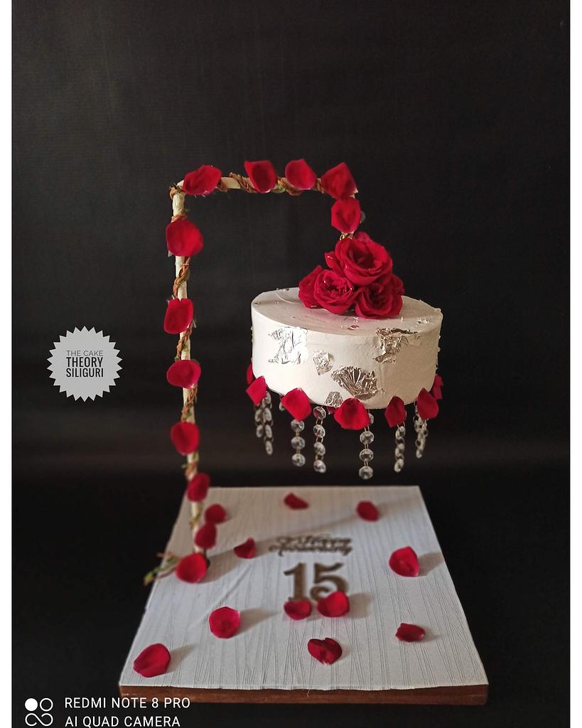 Photo of White three tier suspended wedding cake