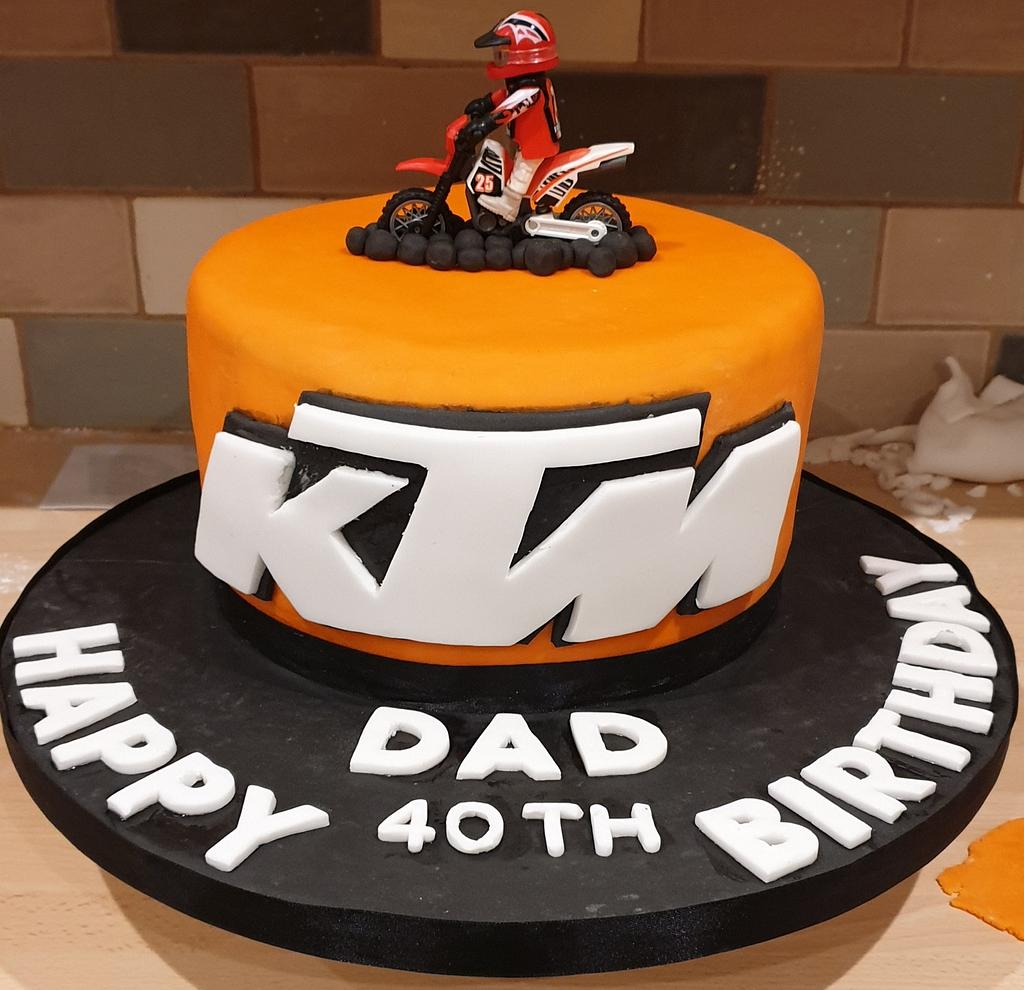 Cupcakes of Distinction - KTM Motorbike 2nd Birthday Cake, Fondant Covered  And The Orange Looked Amazing, One Of Our Very Own KTM Edible Print Logo's.  I Am A Full Time Cake Maker
