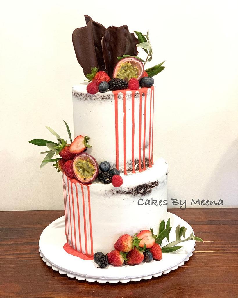 Semi naked red drip cake - Decorated Cake by Meena - CakesDecor