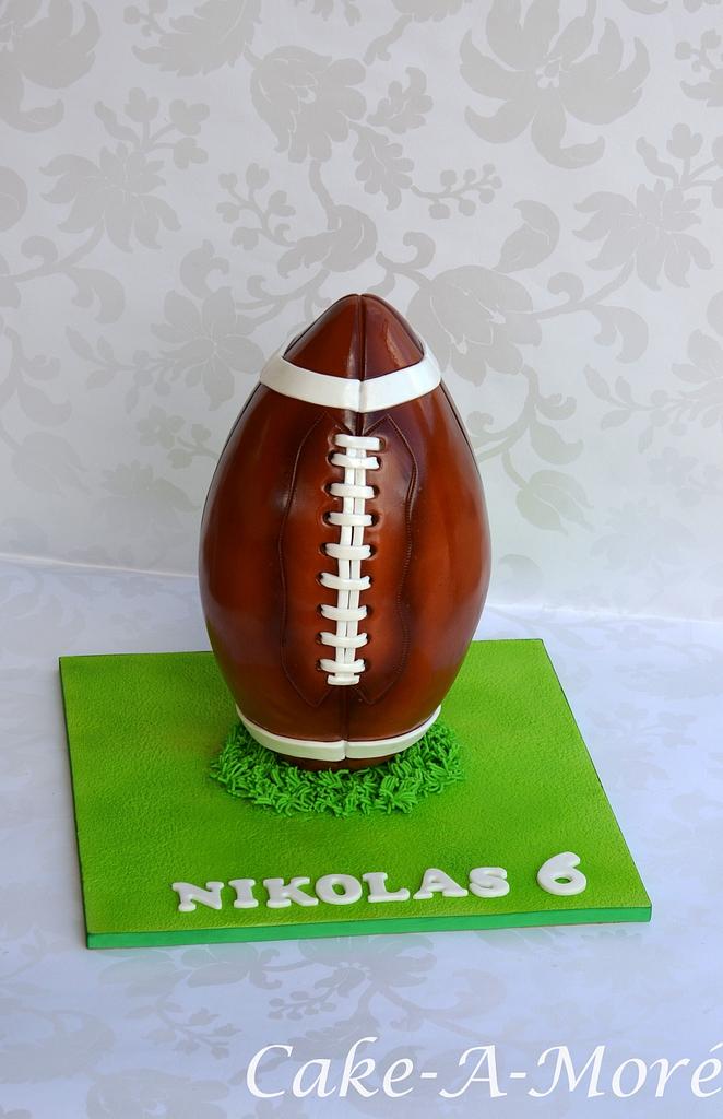 Rugby themed cake made for a rugby player for his birthday. 🏉 🏉 🏉 This  was made with dense chocolate cake base and carved to get the rugby ball  shape and the
