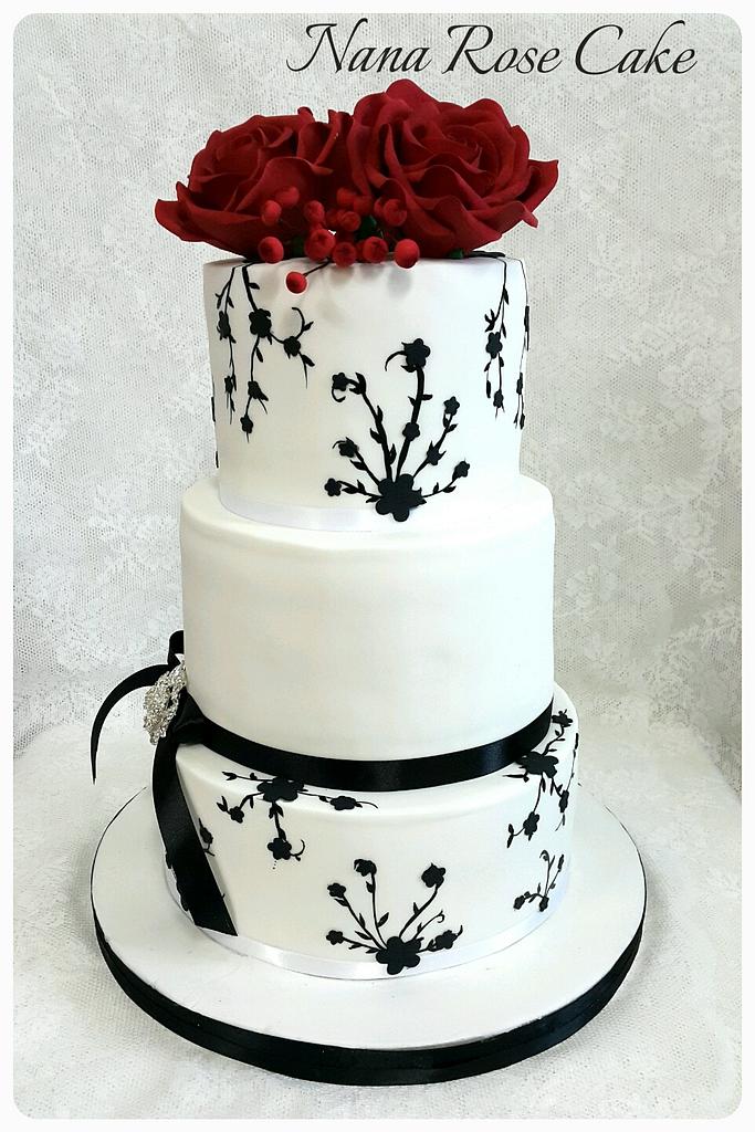 Pretty cake decorating designs we've bookmarked : Hand painted black floral  red and white cake