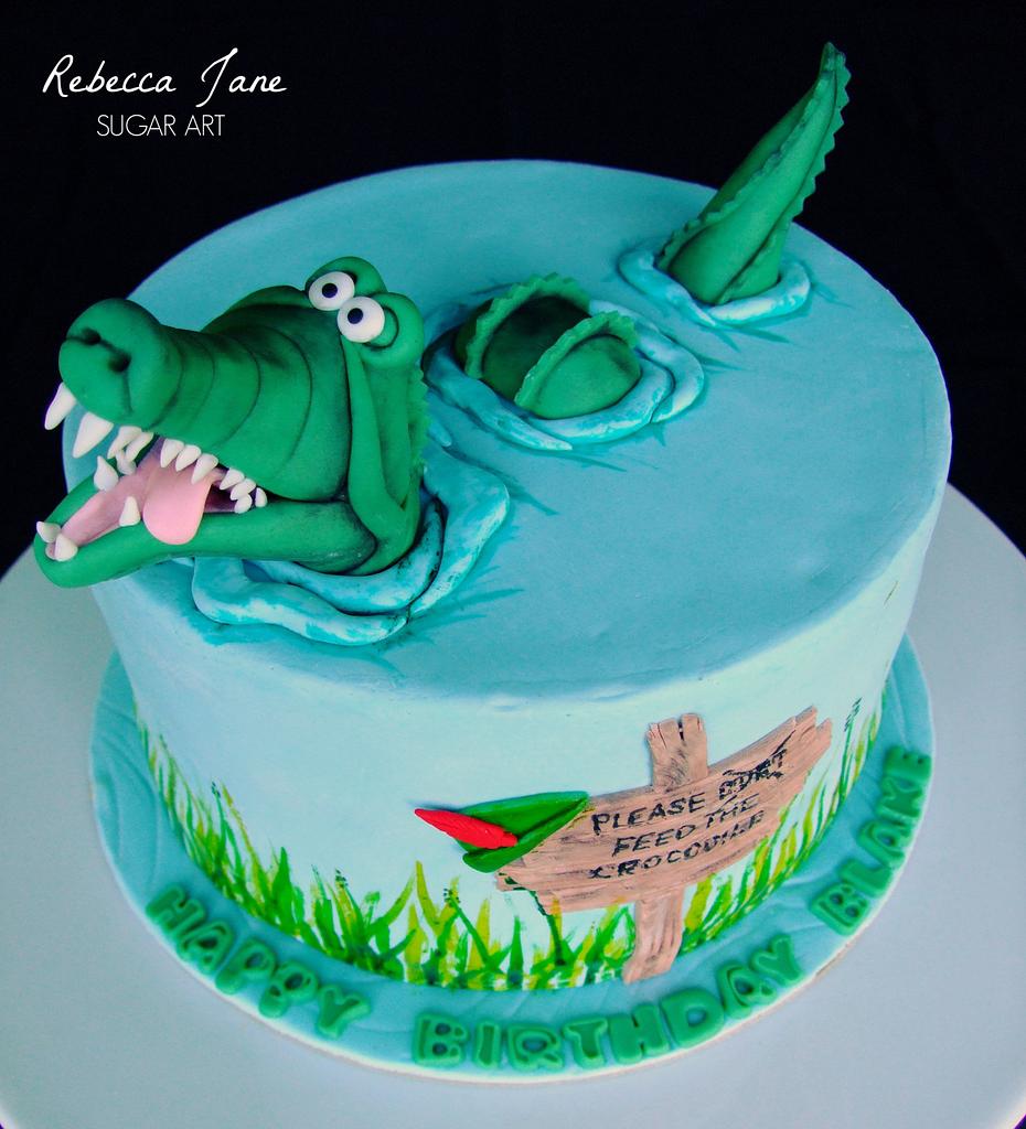 Cartoon Alligator Holding A Piece Of Cake And A Sign Stock Illustration -  Download Image Now - iStock