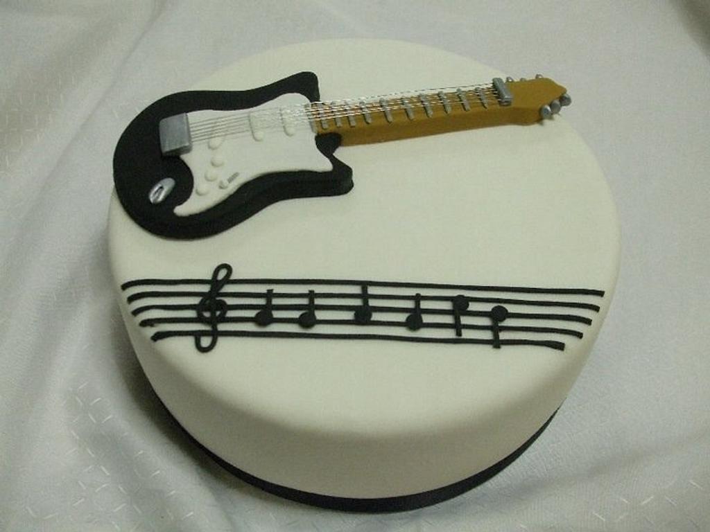 Guitar topper - Decorated Cake by Kake Krumbs - CakesDecor