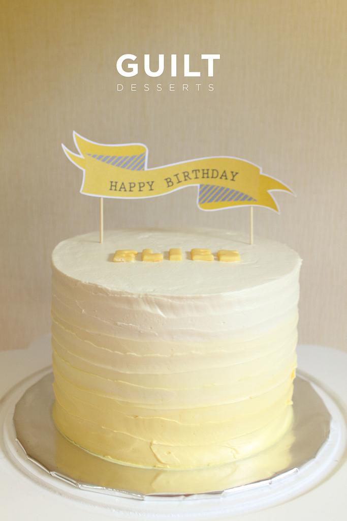 Happy birthday cake, on yellow background Stock Photo - Alamy