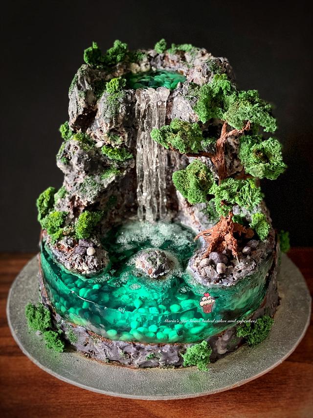 Spiral cake with floral waterfall – The Cake Shop