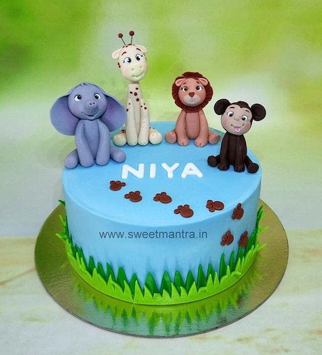 Jungle theme naming ceremony cake Decorated Cake by CakesDecor