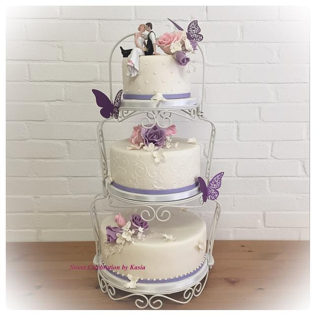 Wedding cake with purple flowers
