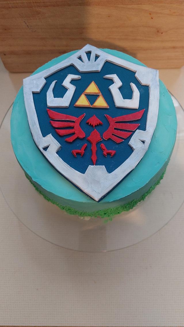 Zelda Hylian shield cake - Decorated Cake by Ira84 - CakesDecor