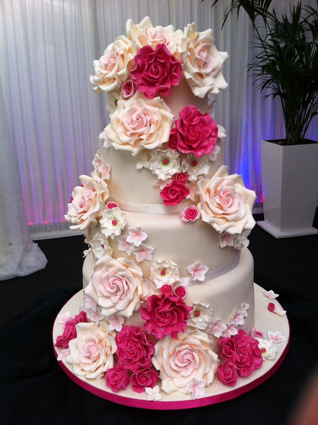 Cascading roses wedding cake - Decorated Cake by Tickety - CakesDecor