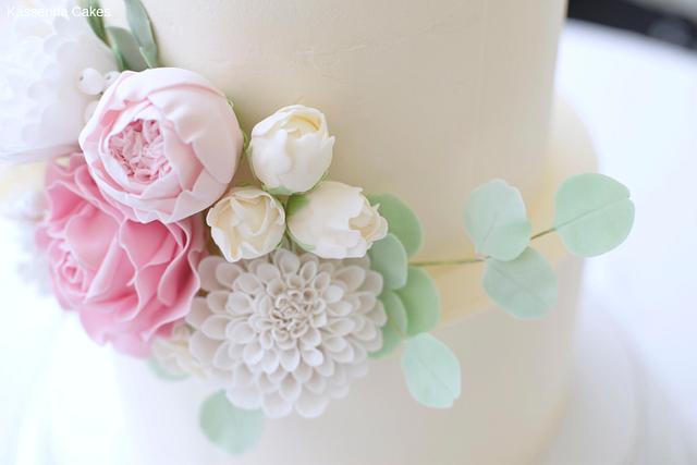 Tiered buttercream cake with handmade sugarpaste flowers