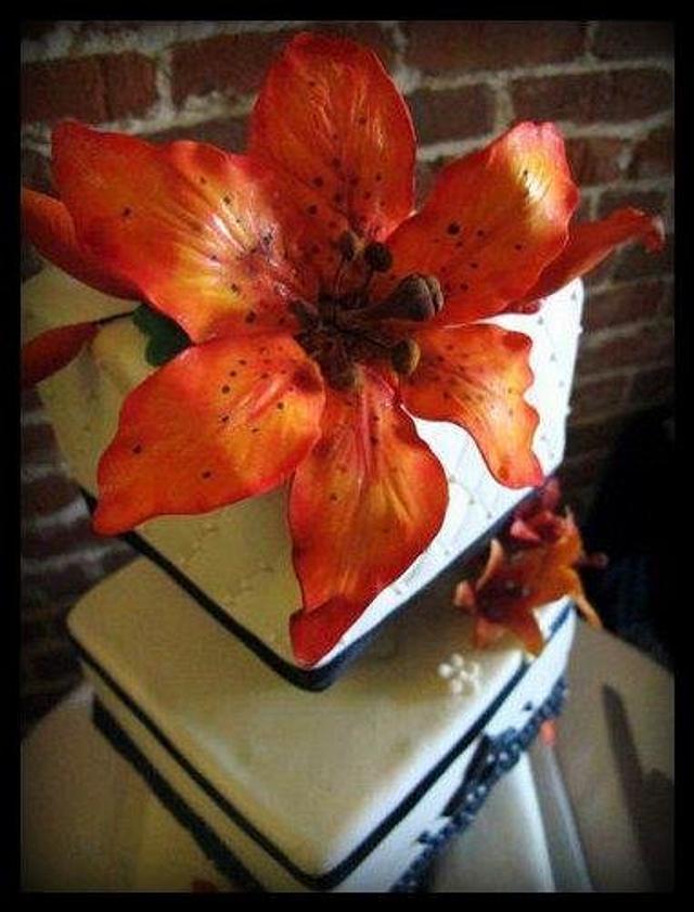 Burnt orange lily wedding cake