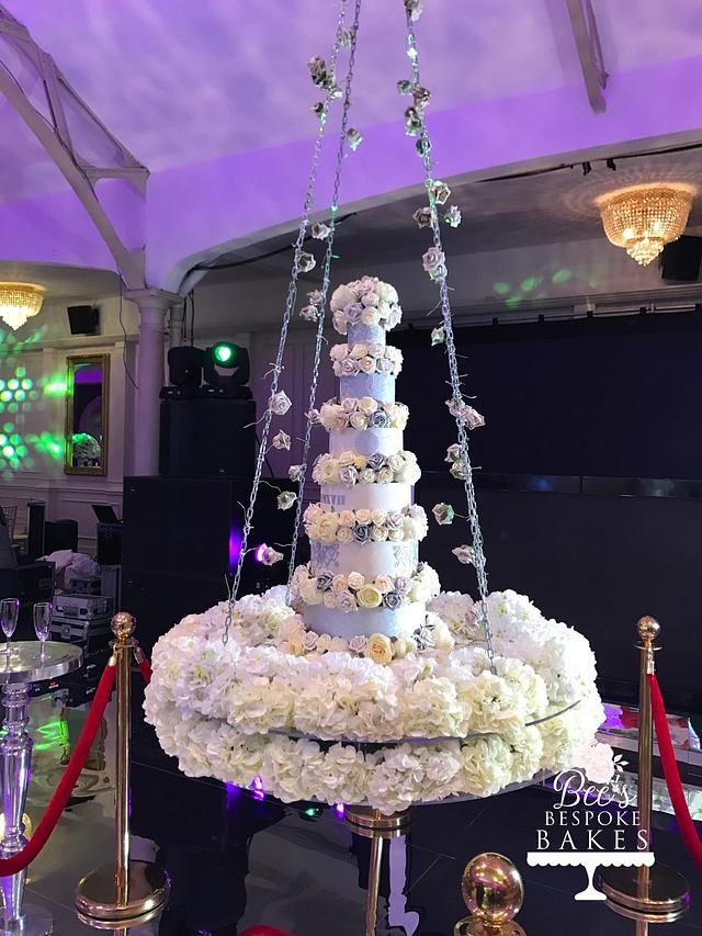Floral swinging wedding cake