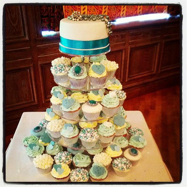 vintage green cupcake wedding tower. - Decorated Cake by - CakesDecor