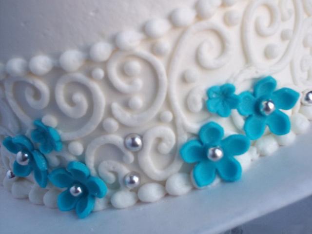 teal blossoms with scrolls