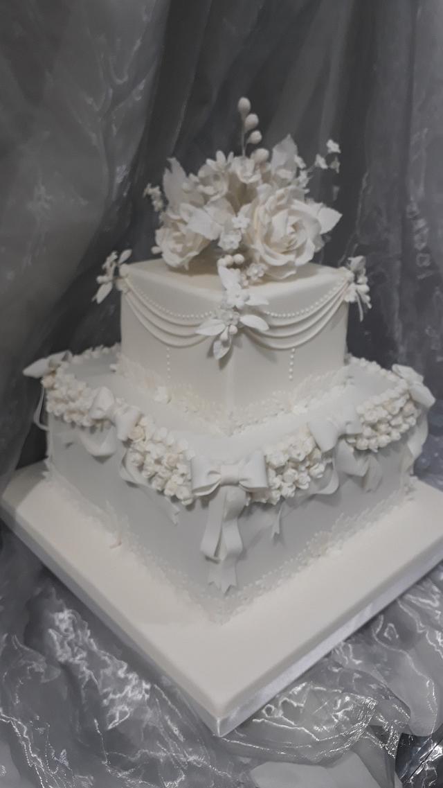 Classic White Wedding Cake - Decorated Cake by Julissa - CakesDecor