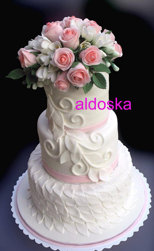 Wedding cake with freesia and roses