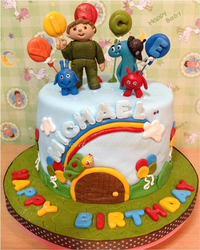 Rainbow color birthday cake with animals, isolated. | CanStock