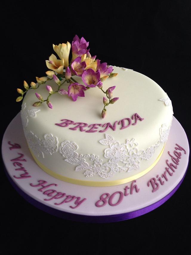 Purple and lemon freesias 80th birthday cake - Decorated - CakesDecor