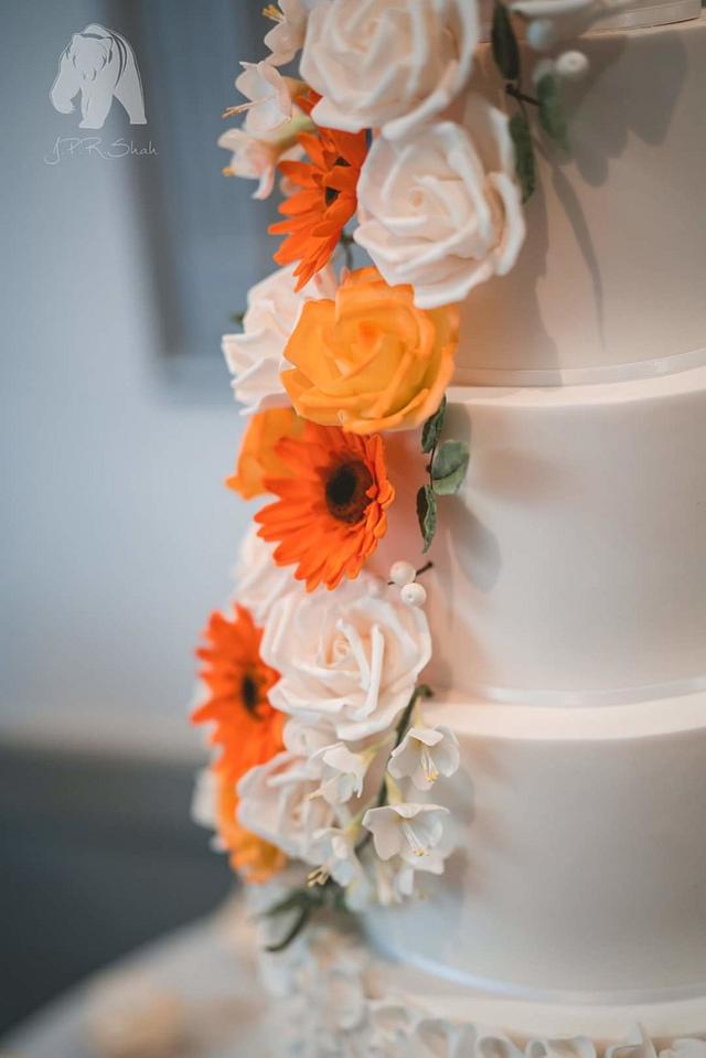 Rose and gerbera cascading wedding cake