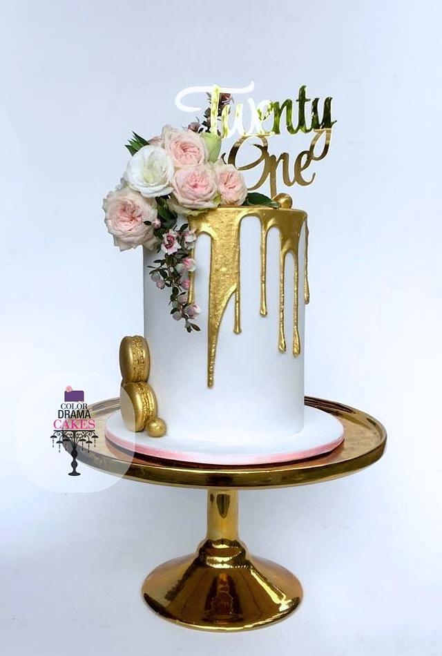 Gold drip cake with fresh flowers