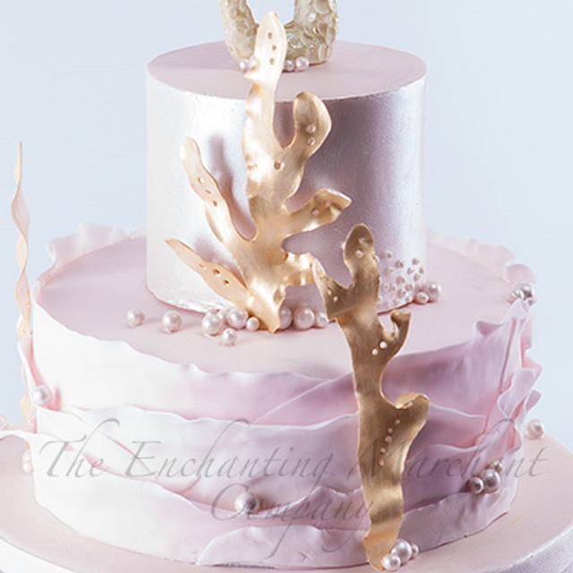 Pink and gold mermaid themed cake