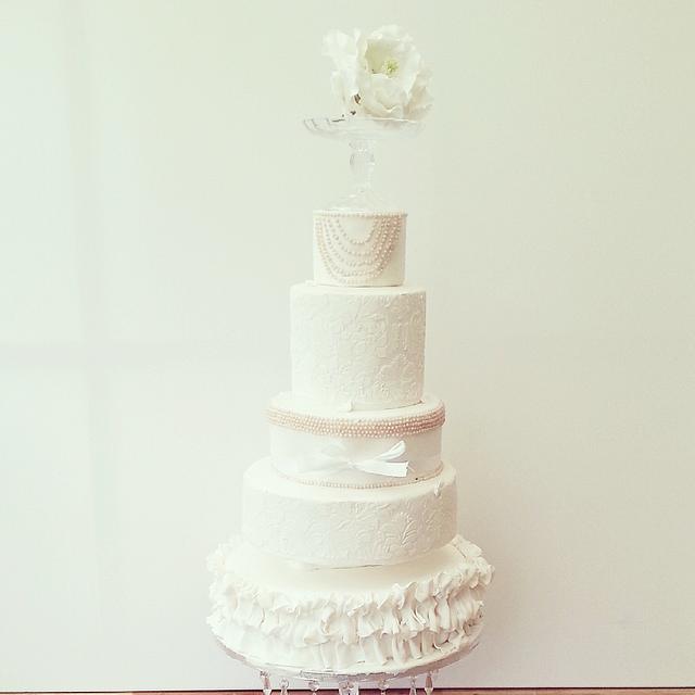 white pearl ruffle wedding cake. - Decorated Cake by Swt - CakesDecor