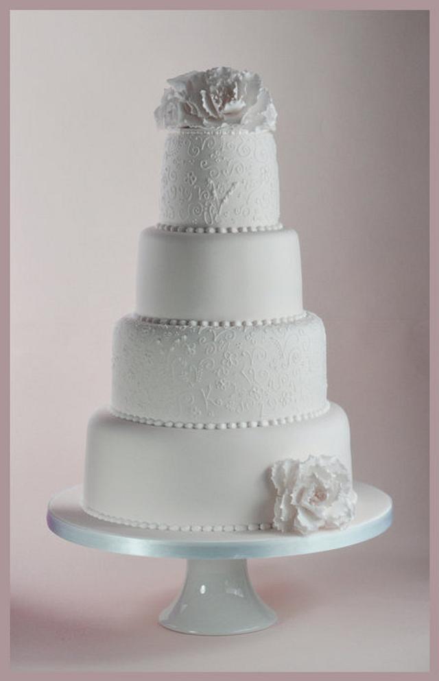 Pure White Wedding Cake - Decorated Cake by Sandra Monger - CakesDecor