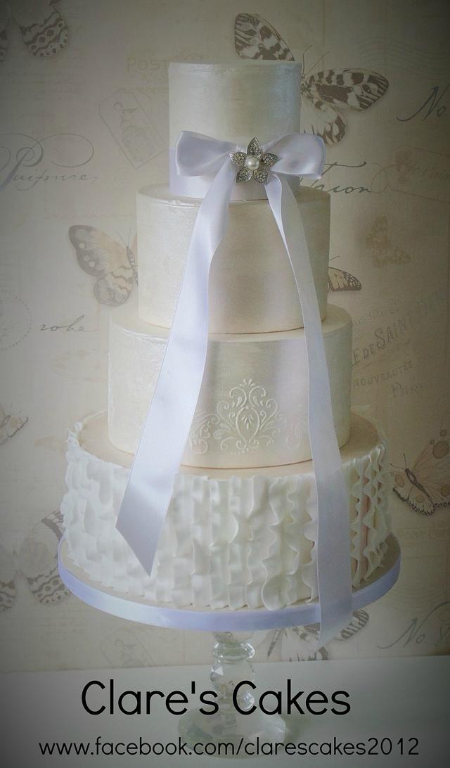 White ruffles and shimmer wedding cake