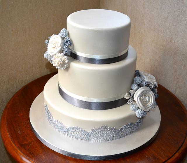 Silver and lace wedding cake - Decorated Cake by Canoodle - CakesDecor