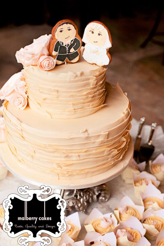 2 tier beige wedding cake with ruffle flowers