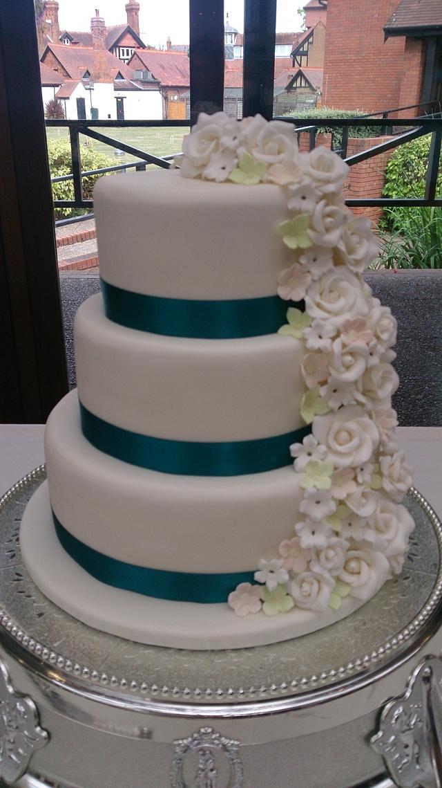 Cascading flower wedding cake Cake by LilleyCakes CakesDecor