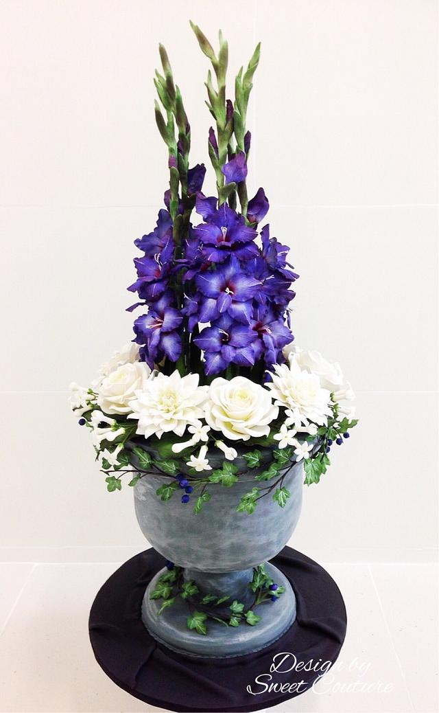 Sugar flowers arrangement  in an urn cake.