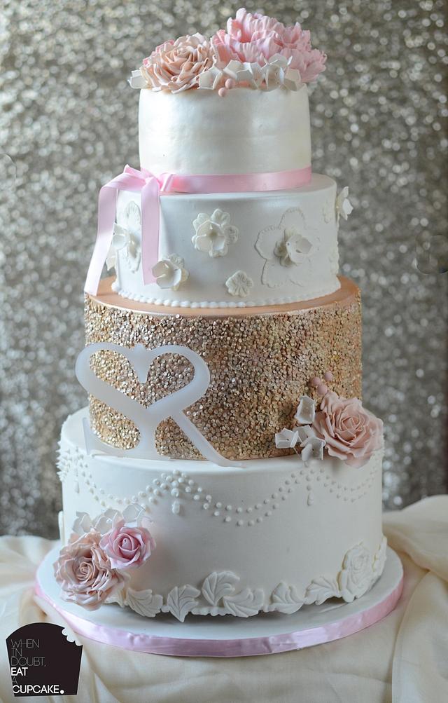 White and gold sequined engagement cake