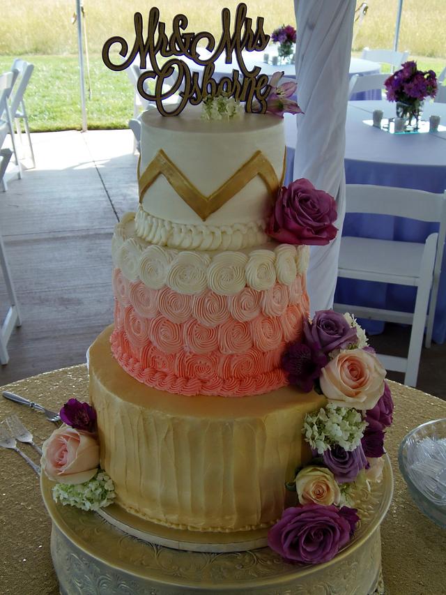Gold, coral, and purple BC wedding cake