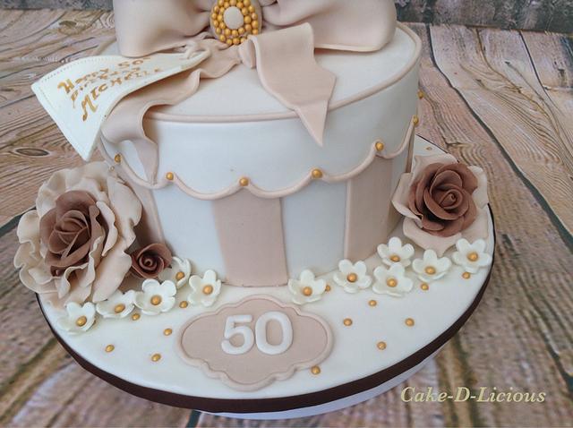 50th Gift Box Cake - Cake by Sweet Lakes Cakes - CakesDecor