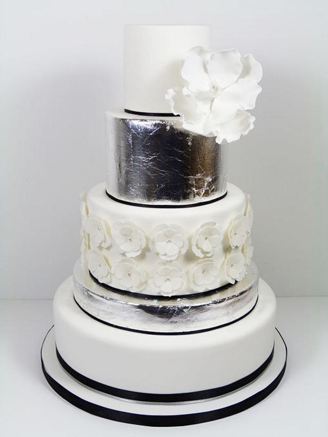 Silver leaf and magnolia wedding cake - Decorated Cake by - CakesDecor