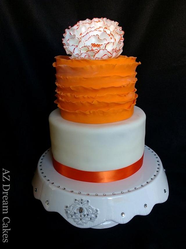 Orange and white ruffle cake