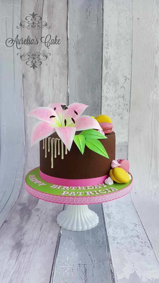 Pink wafer paper lily drip cake.