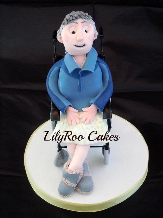 Woman in wheelchair cake topper Decorated Cake by Jo CakesDecor