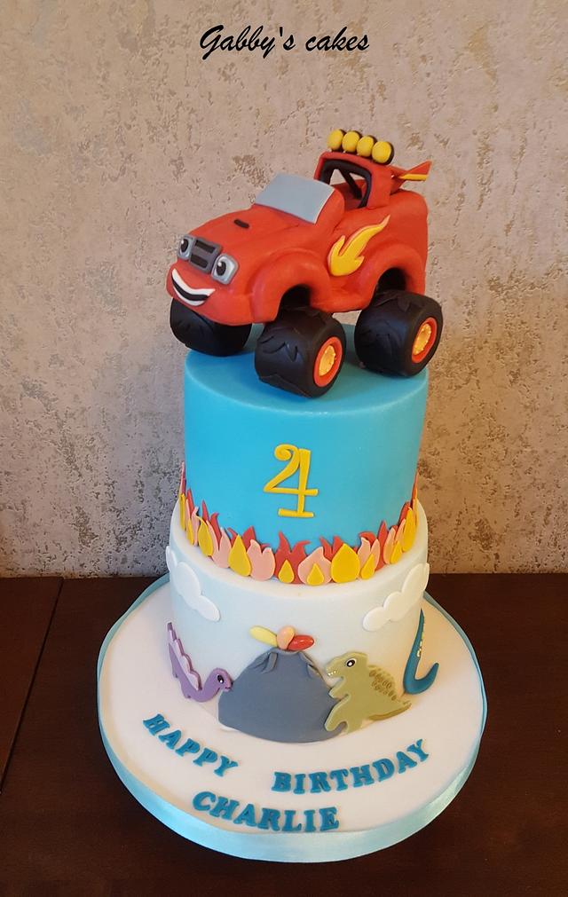 Monster truck and dinosaurs - Decorated Cake by Gabby's - CakesDecor