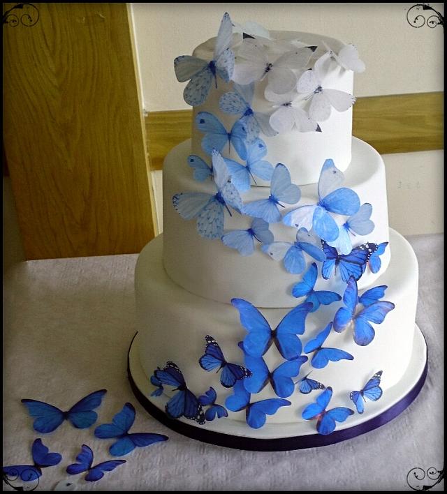 Cascading butterflies Wedding cake - Decorated Cake by - CakesDecor