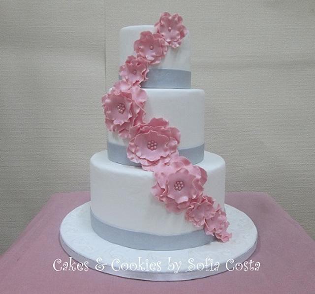 White, silver and pink wedding cake