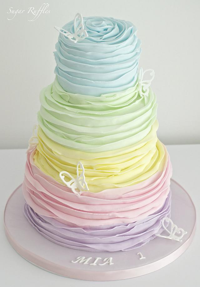 Rainbow Ruffle Cake - Decorated Cake by Sugar Ruffles - CakesDecor