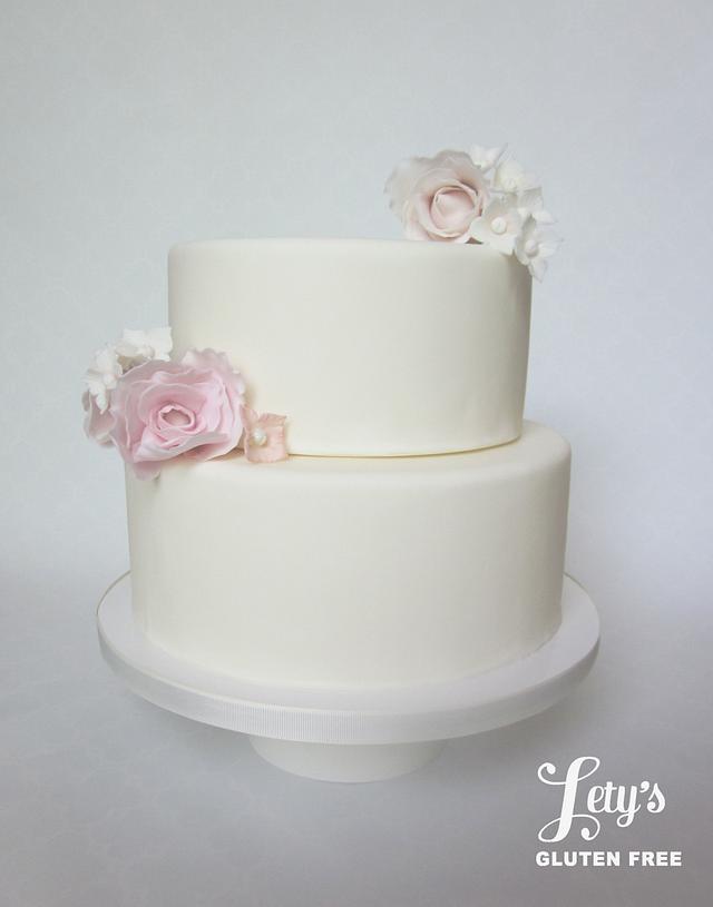 Two tier wedding naked cake with roses | Medcakes